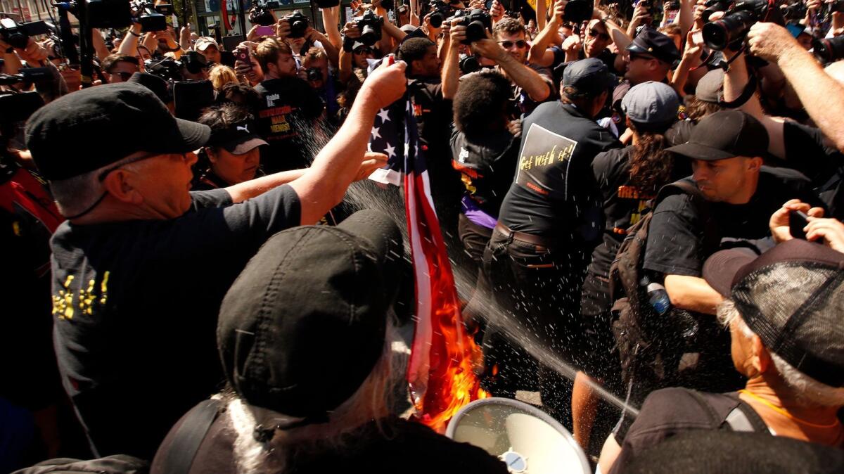 Chaos broke out outside the Republican National Convention in Cleveland on July 20, 2016, when a group of far-left protesters burned an American flag. Riot police moved in to arrest them.