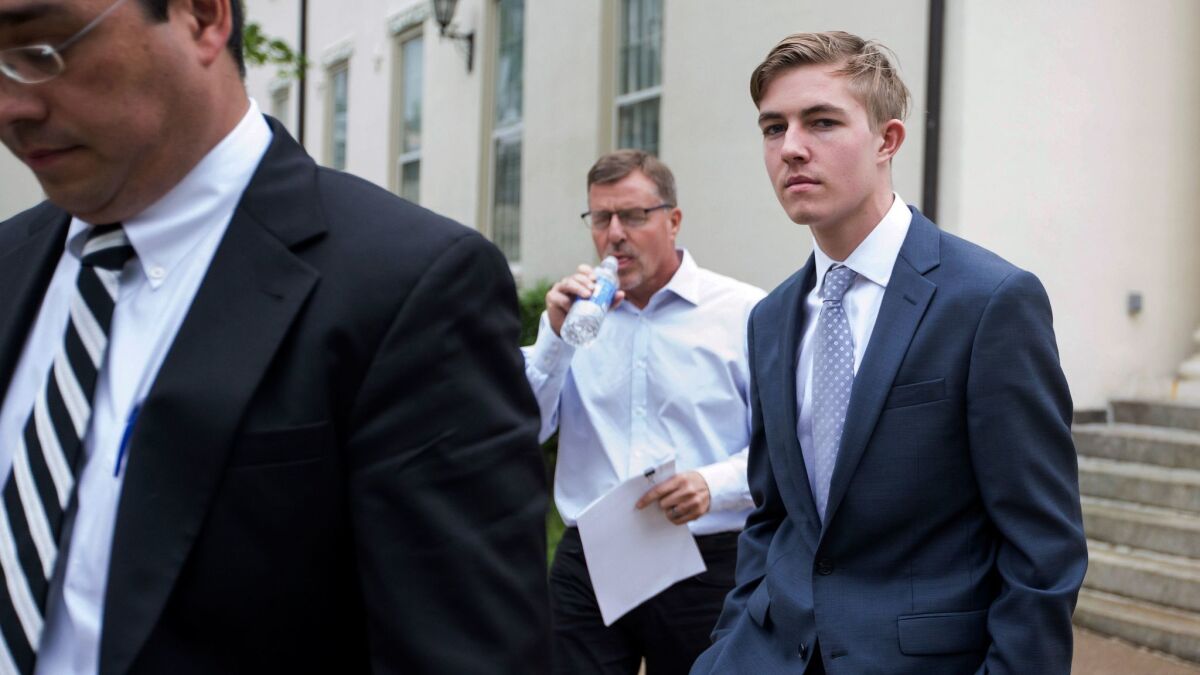 In this Friday, May 5, 2017 photo, Luke Visser, of Encinitas, leaves Centre County Courthouse in Bellefonte, Pa. Visser is one of 18 Penn State Beta Theta Pi fraternity members charged in connection with the February 2017 death of Timothy Piazza.