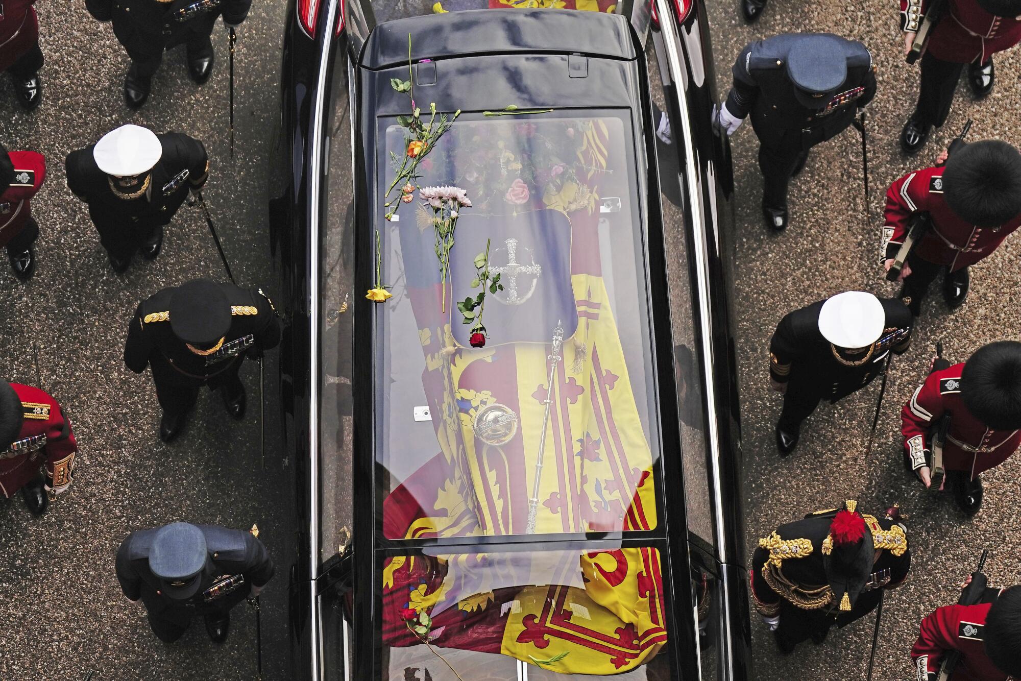 Flowers on the hearse carrying the coffin of Queen Elizabeth II as it arrives at Windsor Castle.