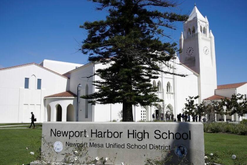 A general view of Newport Harbor High School is shown, Thursday, March 7, 2019, in Newport Beach, Calif. The stepsister of Anne Frank has met with Southern California high school students who were photographed giving Nazi salutes around a swastika formed by drinking cups at a party. Holocaust survivor Eva Schloss spoke to the youths Thursday at Newport Harbor High School in Newport Beach. (AP Photo/Jae C. Hong)