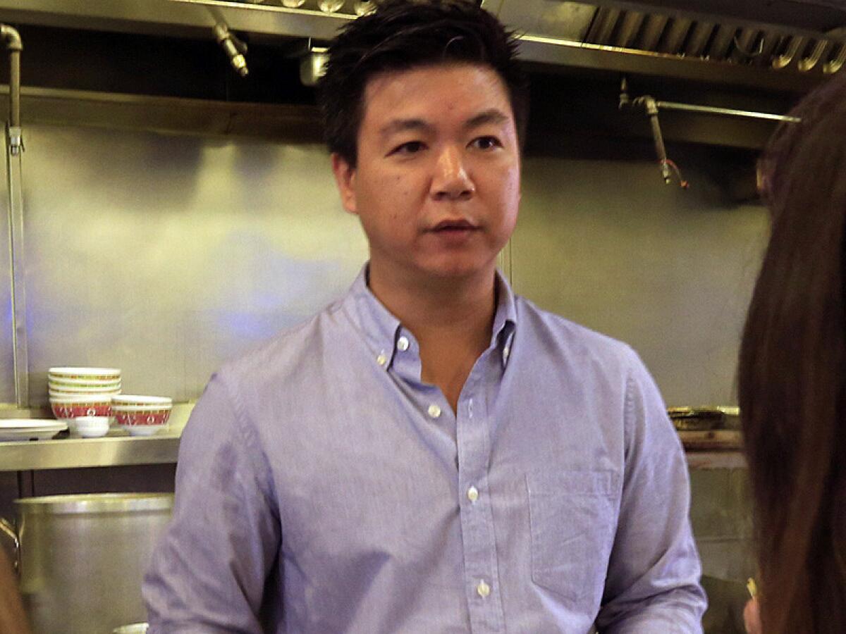 David Tewasart works the counter at his Sticky Rice restaurant in Grand Central Market