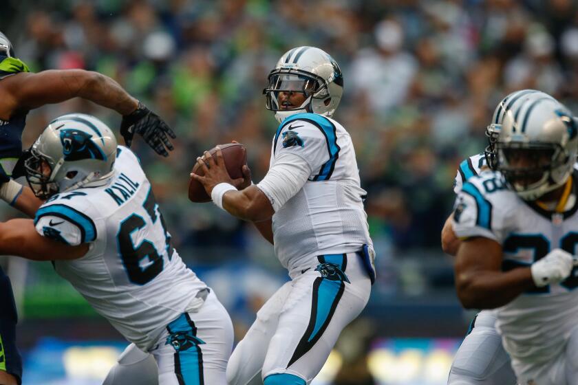 Panthers quarterback Cam Newton passes against the Seahawks during a game on Oct. 18.