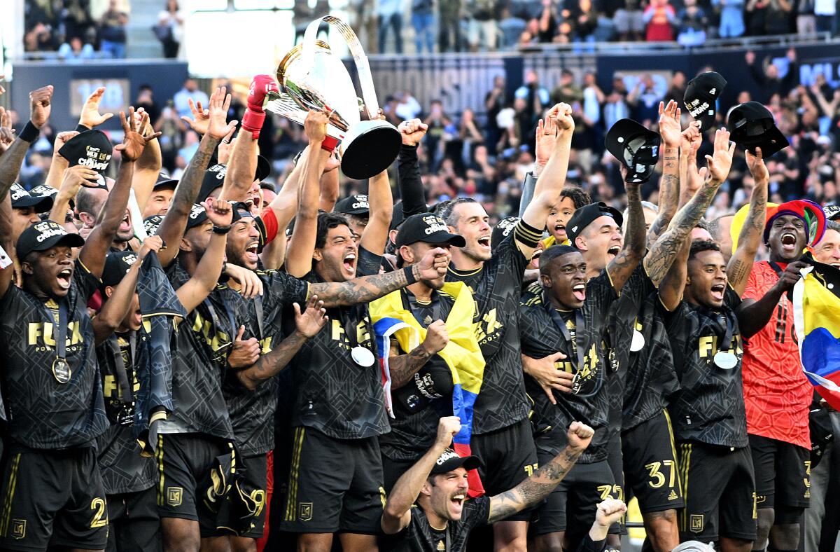 LAFC players celebrate after defeating the Philadelphia Union to win the MLS Cup at Banc of California Stadium.
