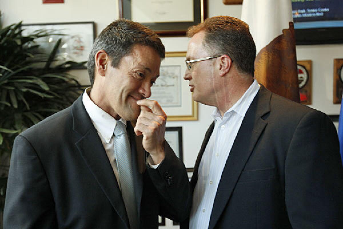 West Hollywood officials John Duran, left, and Jeffrey Prang, who initiated the ban, are shown last year.