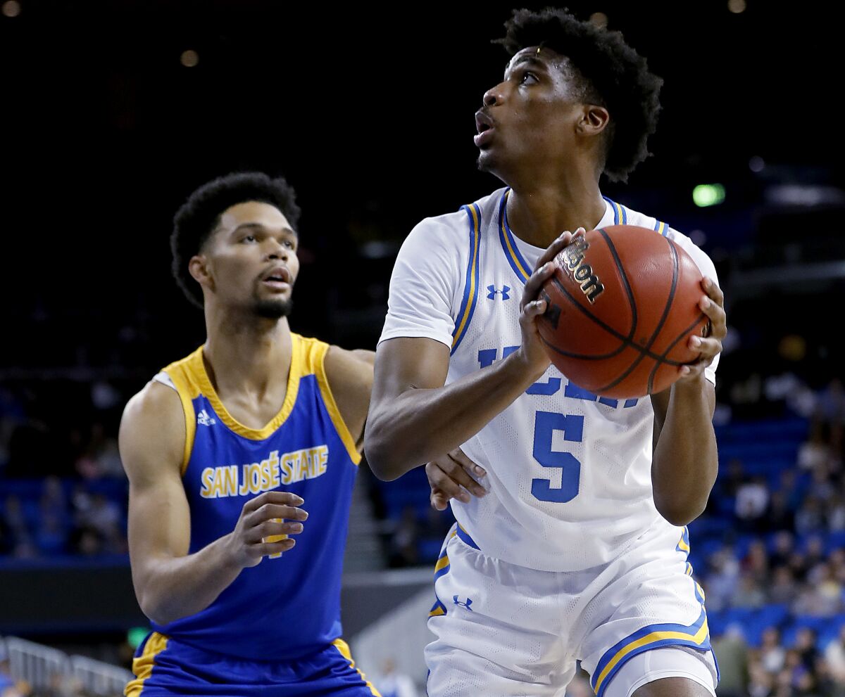 UCLA guard Chris Smith goes to the basket against San Jose State's Zach Chappell in the first half at Pauley Pavilion on Dec. 1, 2019.