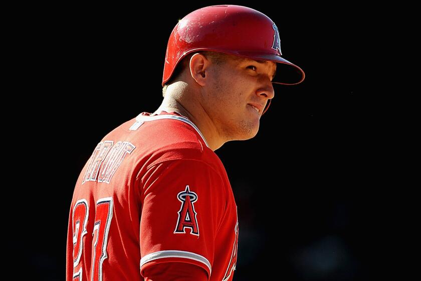 Center fielder Mike Trout, shown during a game against the Red Sox on July 20, is back in the Angels lineup one day after missing his first game because of injury.