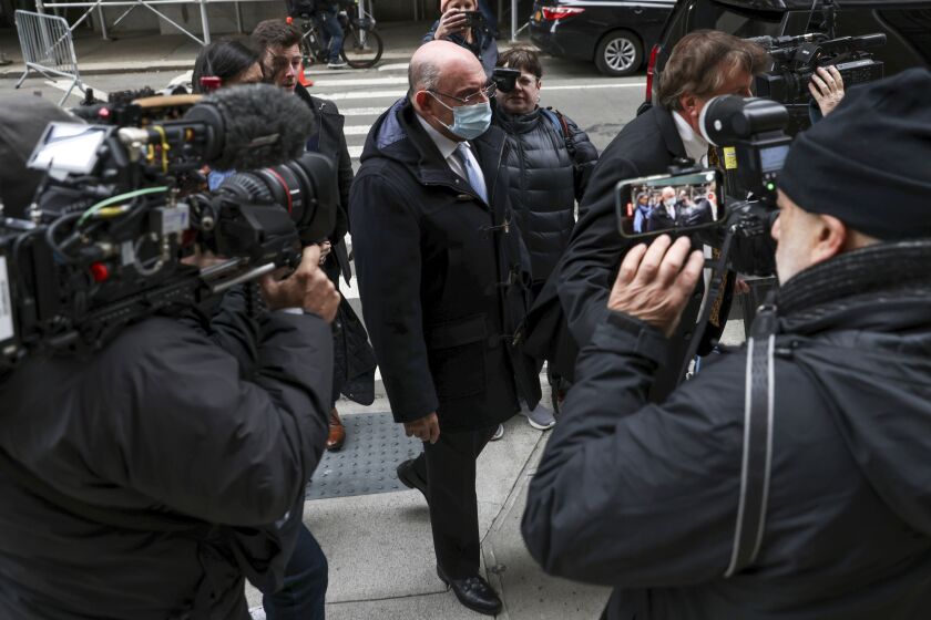 FILE - Trump Organization's former Chief Financial Officer Allen Weisselberg, center, arrives to court on Nov. 15, 2022, in New York. Closing arguments are slated for Thursday, Dec. 1, in Donald Trump's company’s criminal tax fraud case. Prosecutors and defense lawyers say those could take seven hours or more. Those projections speak to the complexity of the case, which stems from longtime Trump Organization finance chief Weisselberg's 15-year scheme to avoid taxes on company-paid perks including an apartment and luxury cars. (AP Photo/Julia Nikhinson, File)
