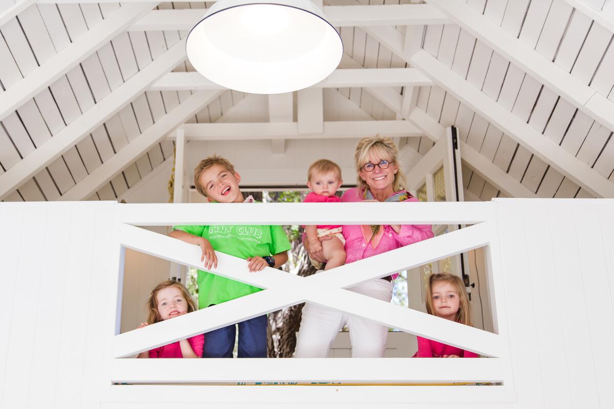 Newport Beach designer Cher Beall gathers with her grandchildren in the reading loft of the Tiny Club.