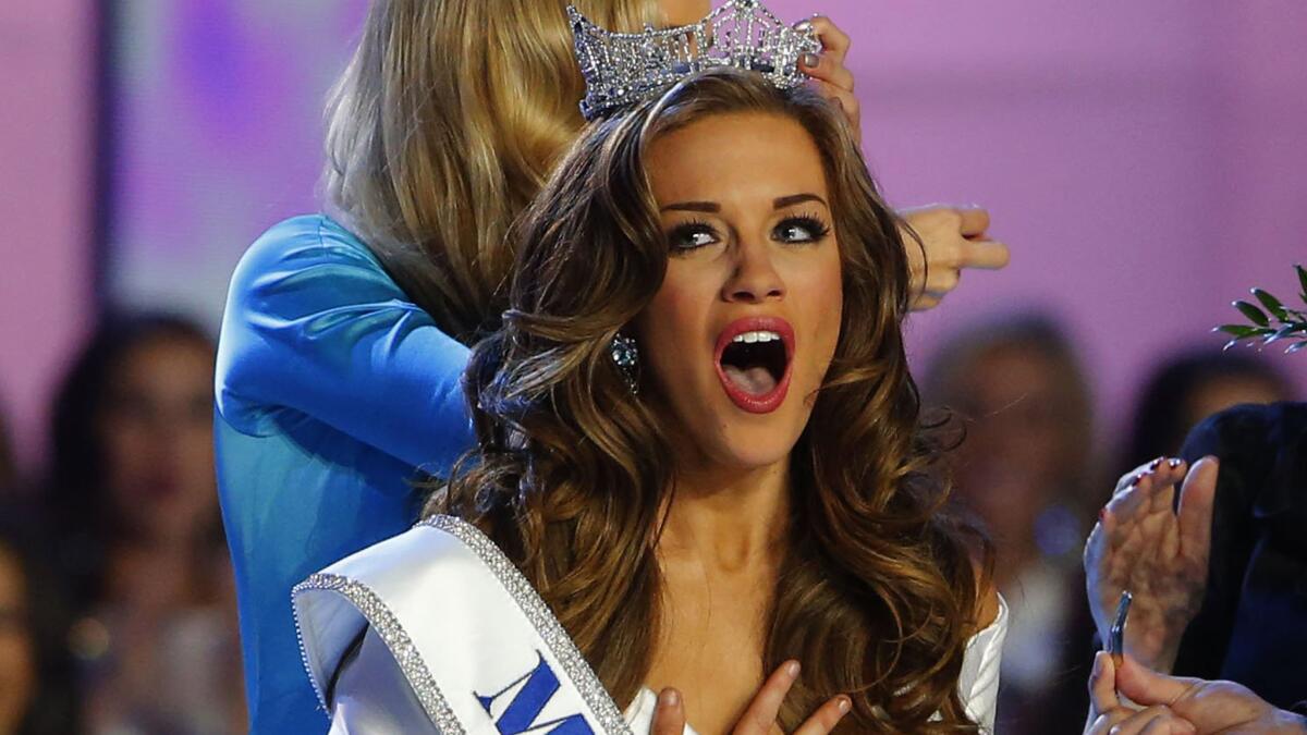 Miss Georgia Betty Cantrell is crowned Miss America for 2016, with Miss America 2015 Kira Kazantsev doing the tiara-placement honors.