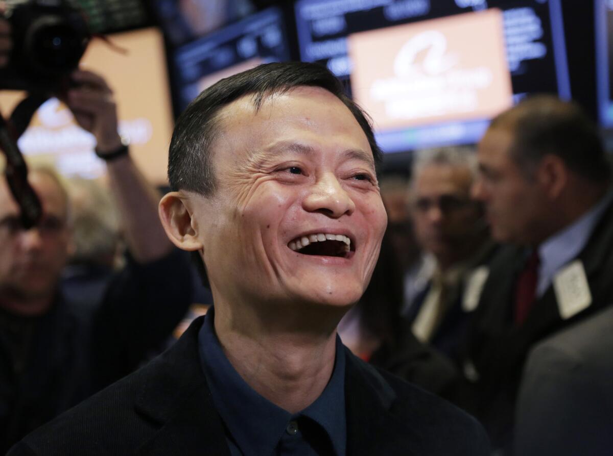 Jack Ma, founder of Alibaba, smiles during the company's IPO at the New York Stock Exchange on Friday. His share of the company was valued at about $18 billion at Friday's close.