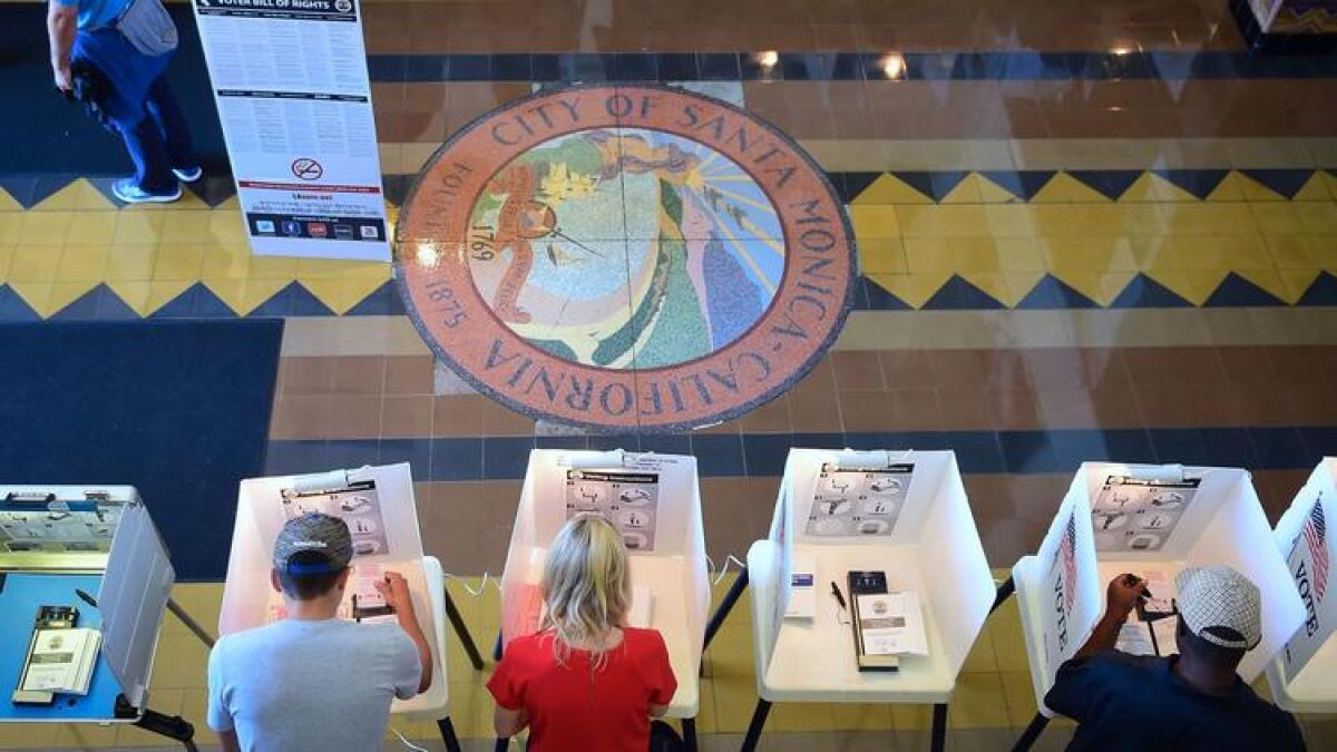 Voters cast their ballots in Santa Monica City Hall