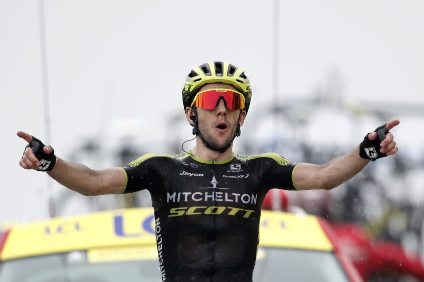 Simon Yates celebrates as he crosses the finish line to win the 15th stage of the Tour de France on Sunday.