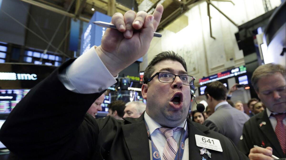 A trader works on the floor of the New York Stock Exchange.