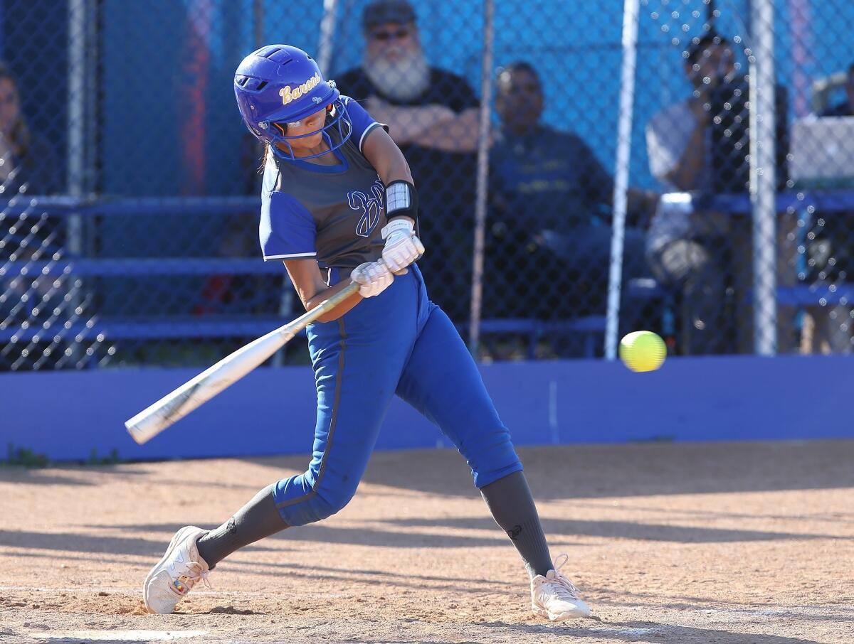 Fountain Valley High's Samara Ortega drives the ball for a hit in a Wave League game against Newport Harbor on Wednesday.