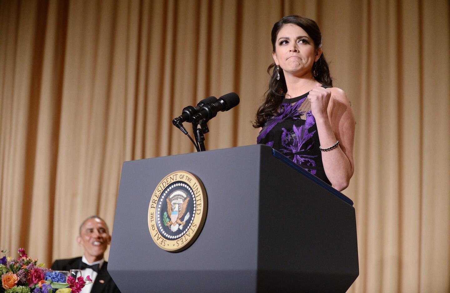 "Saturday Night Live" comedian Cecily Strong speaks as President Obama looks on during the annual White House Correspondents' Assn. Gala at the Washington Hilton hotel on Saturday.