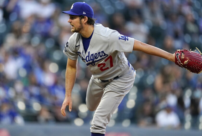 Los Angeles Dodgers starting pitcher Trevor Bauer works against the Colorado Rockies in the first inning of a baseball game Friday, April 2, 2021, in Denver. (AP Photo/David Zalubowski)