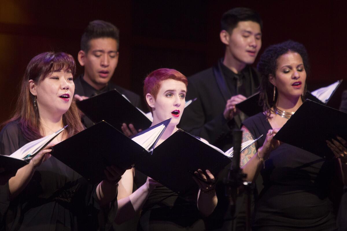 Singers with the Pacific Chorale perform. 