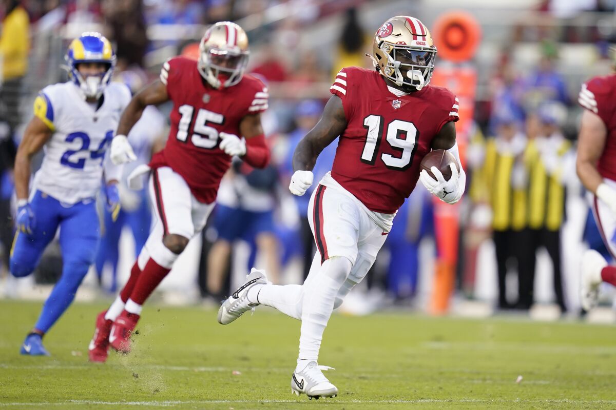 San Francisco 49ers wide receiver Deebo Samuel (19) runs toward the end zone to score against the Los Angeles Rams during the first half of an NFL football game in Santa Clara, Calif., Monday, Oct. 3, 2022. (AP Photo/Godofredo A. Vásquez)