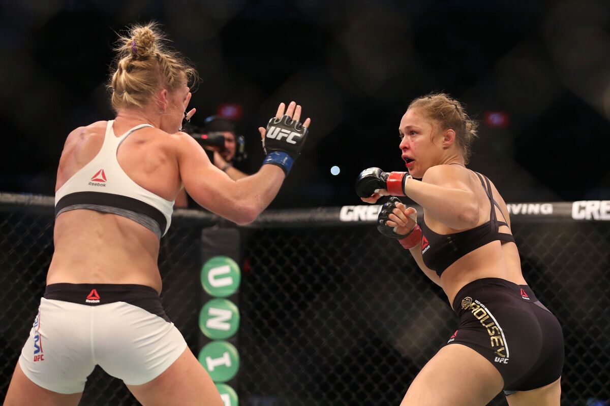 Holly Holm, left, pulled off one of the biggest upsets in UFC history by defeating Ronda Rousey in November 2015 in Melbourne, Australia.