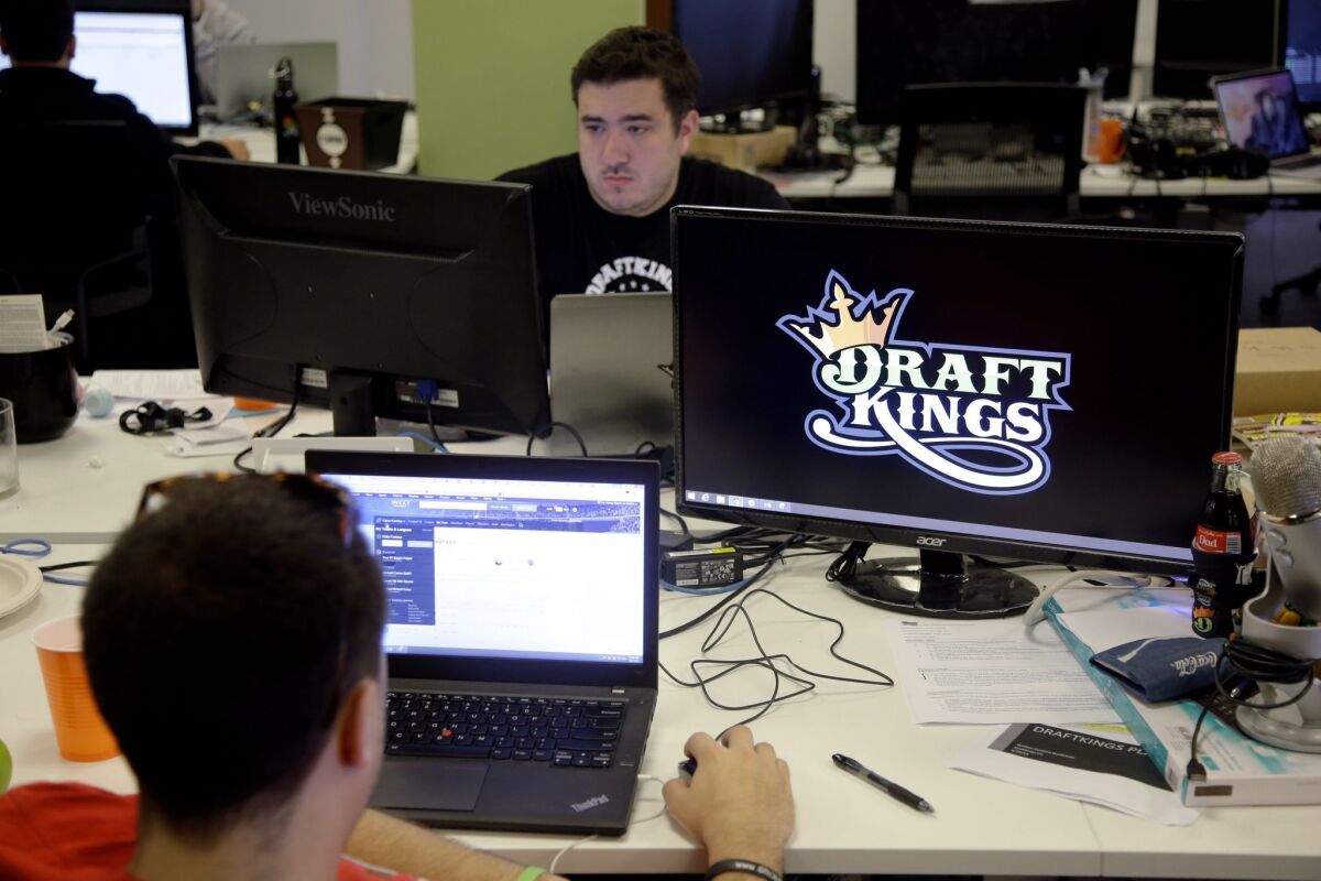 DraftKings employees work at the company's offices in Boston last month.