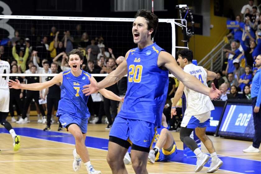 Long Beach, CA - May 04: Outside Hitter Ethan Champlin #20 celebrates along with teammate Andrew Rowan #7 of UCLA Bruins after defeating Long Beach State 25-21, 25-20, (29-27), 25-21 to win the NCAA men's volleyball national championship in the Walter Pyramid on the campus of Cal State Long Beach in Long Beach on Saturday, May 4, 2024. (Photo by Keith Birmingham/MediaNews Group/Pasadena Star-News via Getty Images)