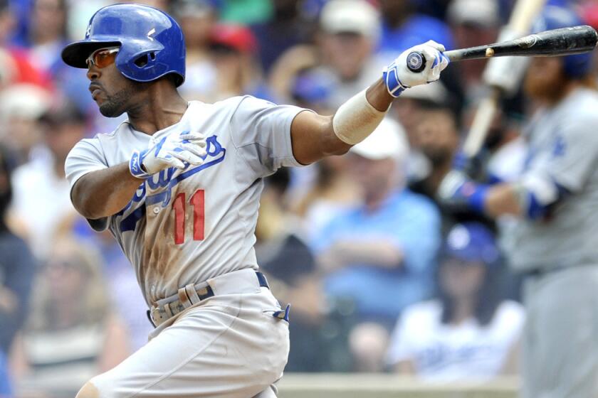 Los Angeles Dodgers' Jimmy Rollins hits a RBI single during the second inning against the Chicago Cubs on Thursday. Dodgers won 4-0.
