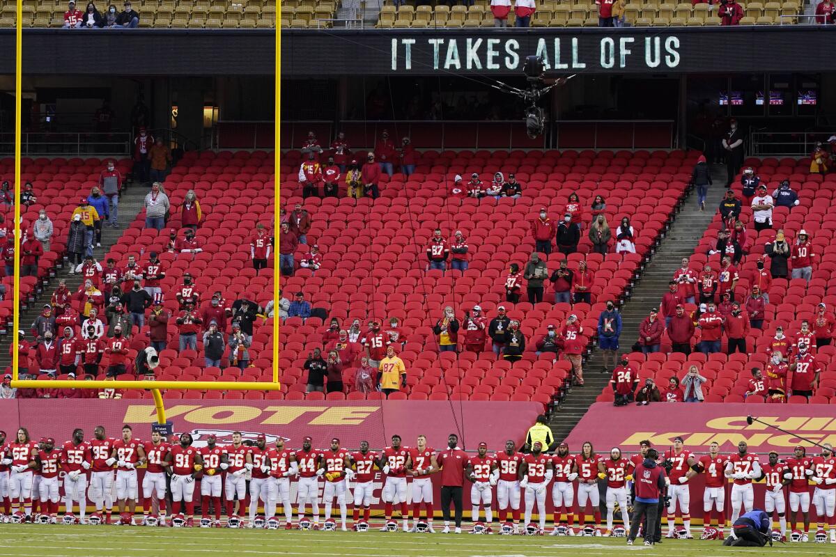 Kansas City Chiefs players stand for a presentation on social justice before game against the Texans.