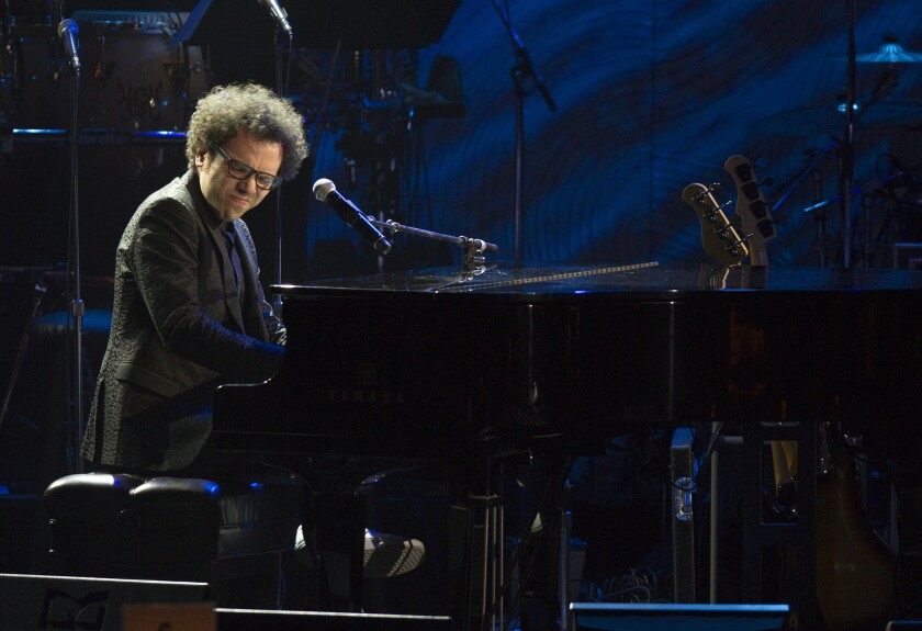 Ian Axel of A Great Big World performs on stage during the 2014 Pre-Grammy Gala