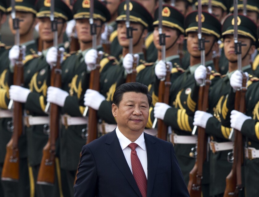 Chinese President Xi Jinping inspects a guard of honor outside the Great Hall of the People in Beijing.
