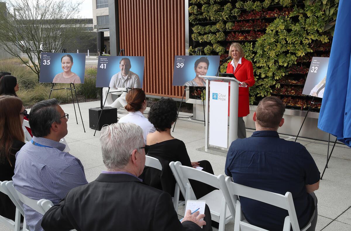 Annette Walker, President of City of Hope Orange County, addresses the audience during a press conference on Tuesday.