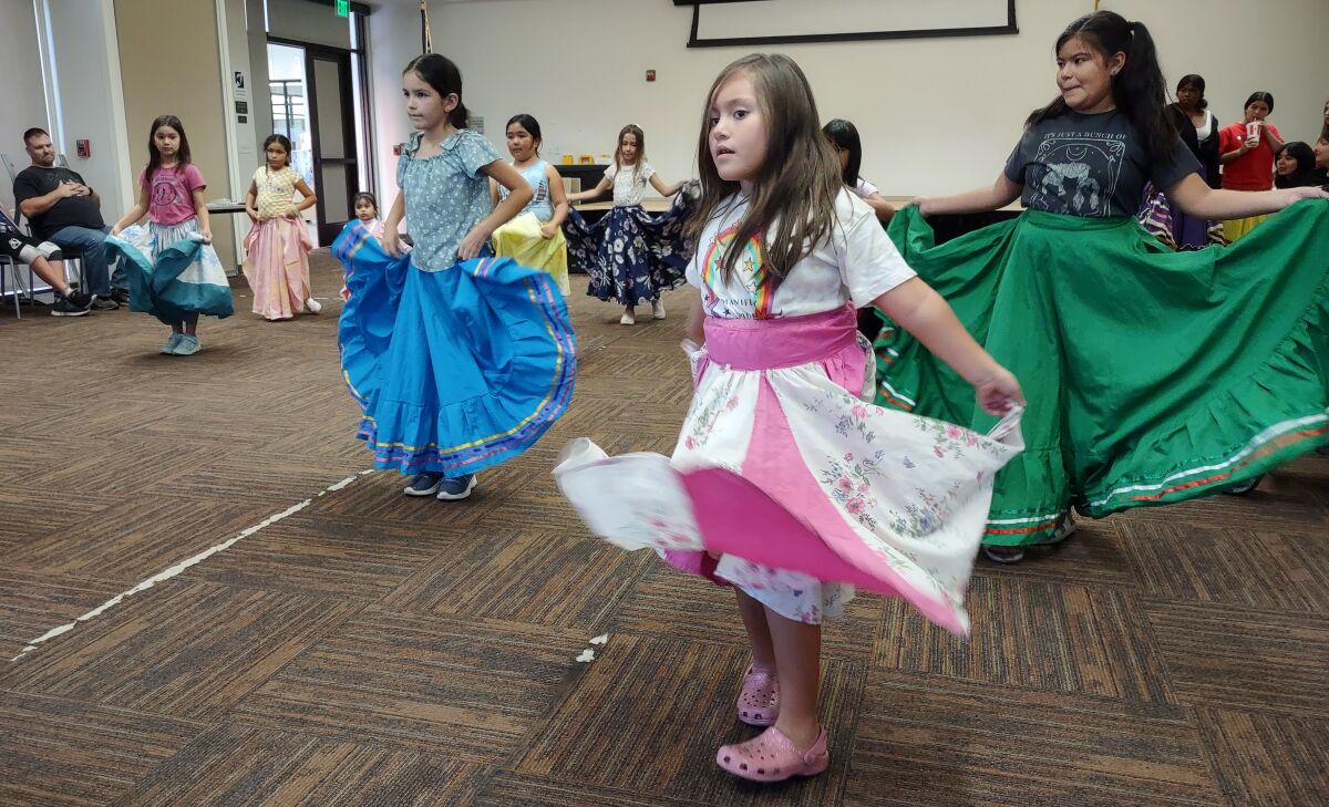 The dancers have fun swinging their skirts during certain dance routines.