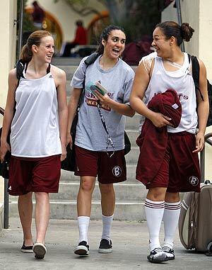 Gizelle Studevent, center, with teammates, Alyssa Morgosh, left, and Yessica Palmer walk to their cars after basketball practice at Bishops School in La Jolla. Studevent, 17, a top-ranked basketball player being recruited by colleges such as Duke and Stanford, transferred from La Jolla Country Day School after facing years of bullying there.