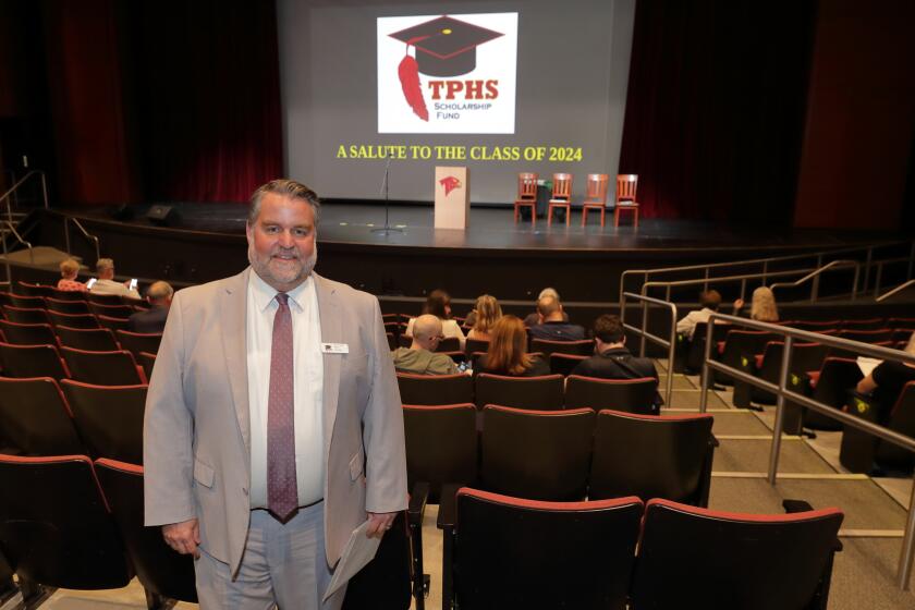 Principal Rob Coppo prepares for the TPHS Scholarship Fund Awards Ceremony