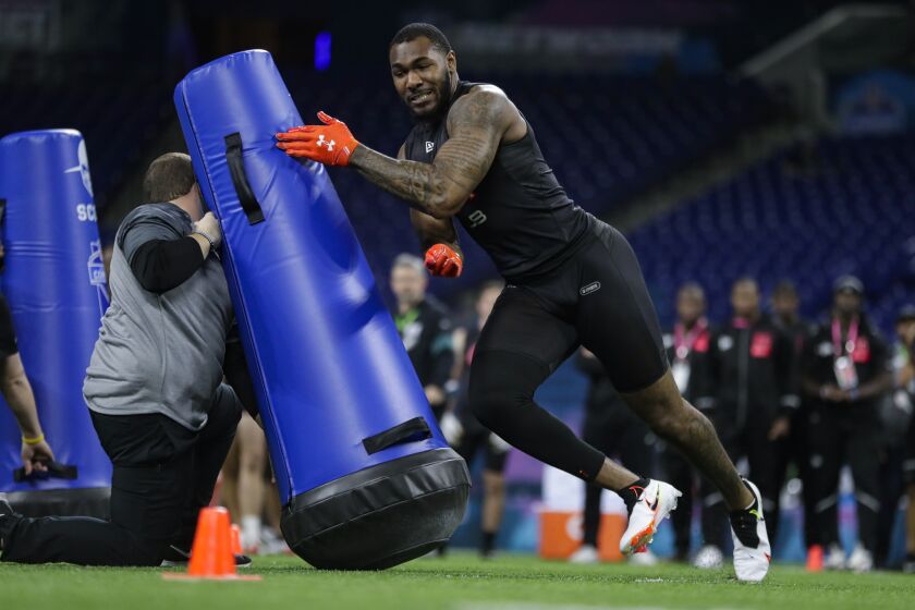 Alabama linebacker Terrell Lewis runs a drill at the NFL football scouting combine in Indianapolis, Saturday, Feb. 29, 2020. (AP Photo/Michael Conroy)