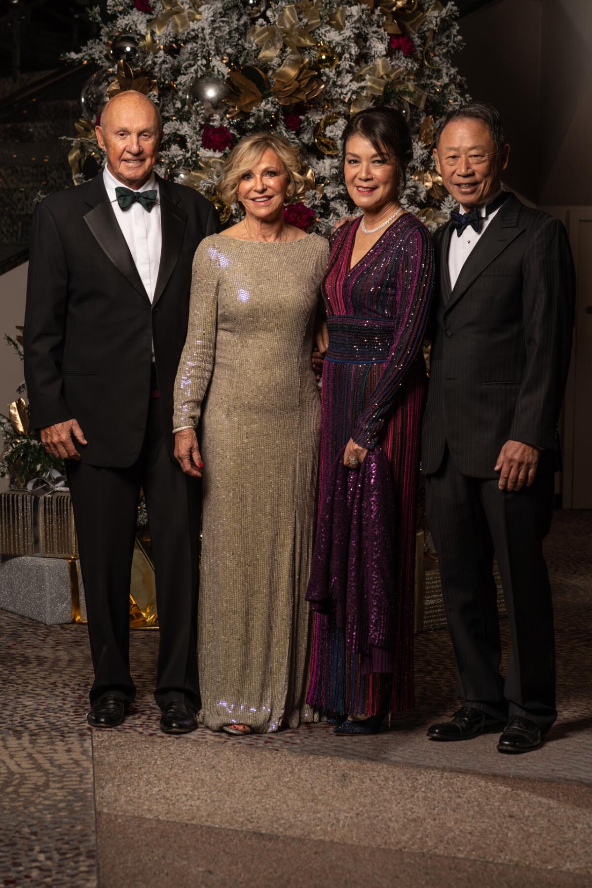 Chairman Larry Higby and Dee Higby join major donors Betty Huang and S.L. Huang at the Candlelight Concert.