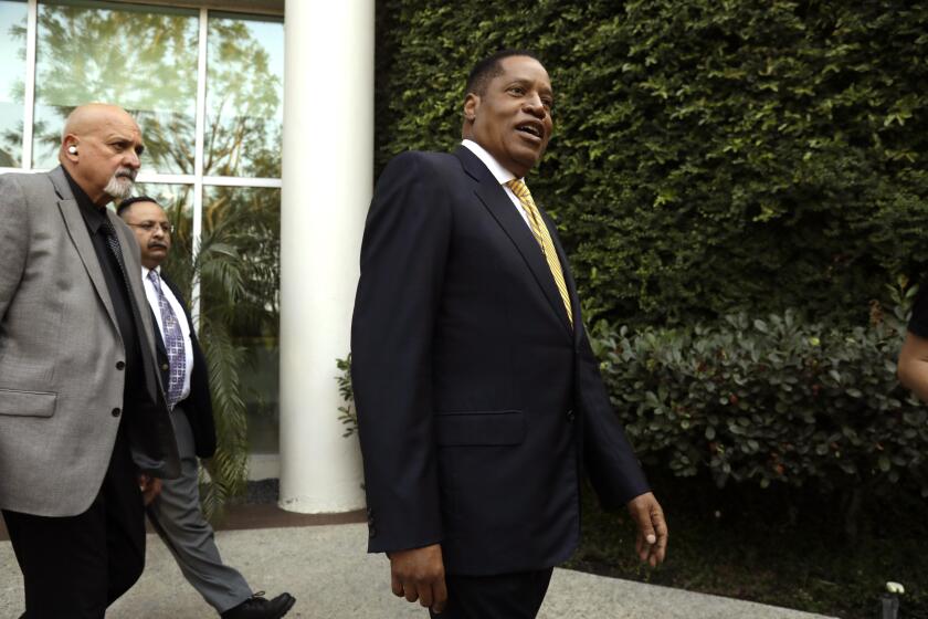WOODLAND HILLS, CA - AUGUST 24, 2021 - Conservative radio talk show host Larry Elder, who is running for governor of California, greets supporters at the Warner Center Marriott in Woodland Hills on August 10, 2021. (Genaro Molina / Los Angeles Times)