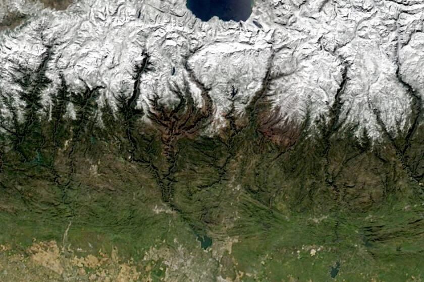 A satellite view of the Sierra Nevada covered in snow 