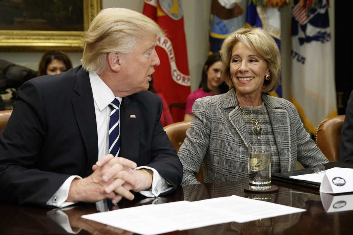 President Trump with Education Secretary Betsy DeVos at the White House.