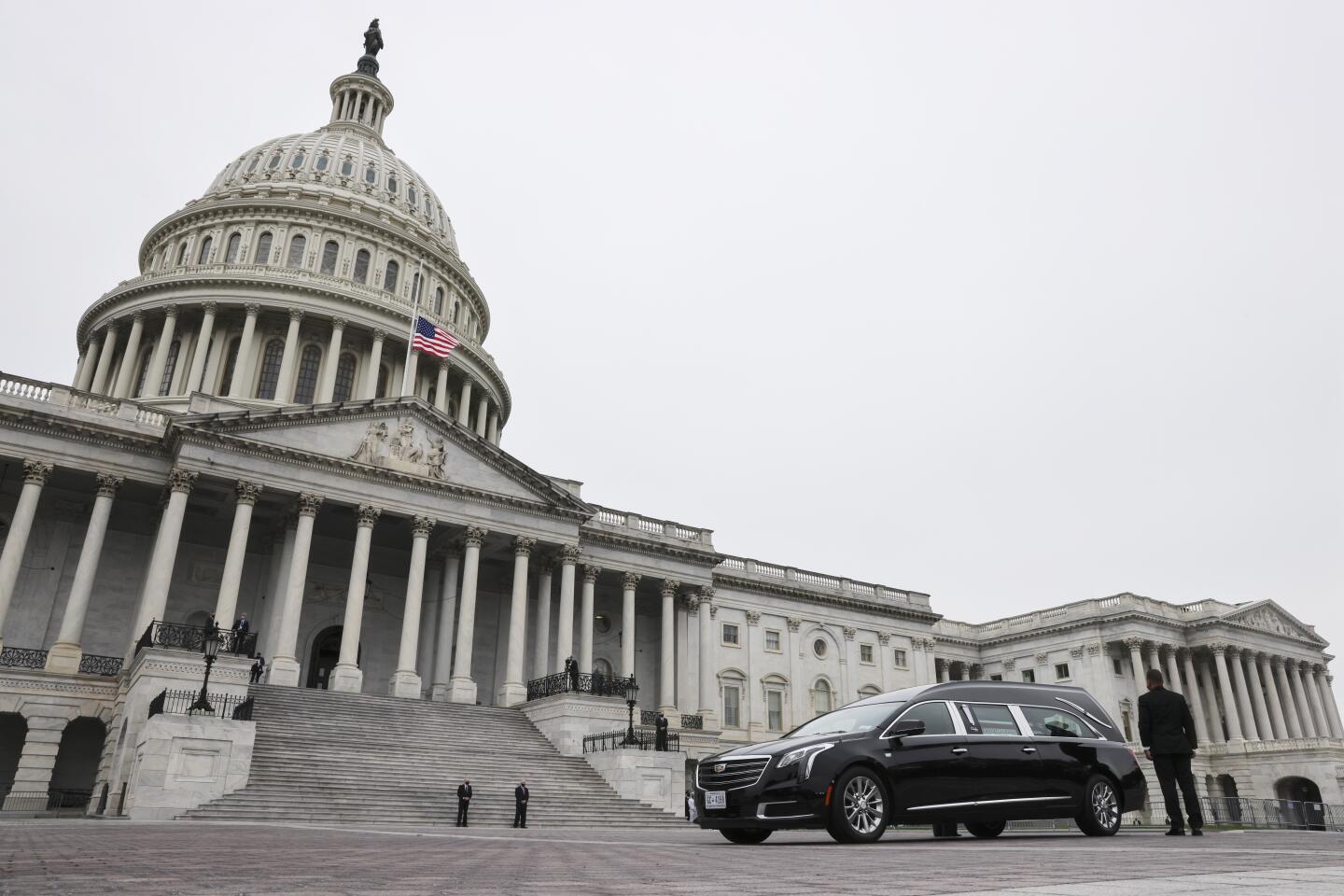 The hearse carrying the casket of Justice Ruth Bader Ginsburg arrives at the U.S. Capitol