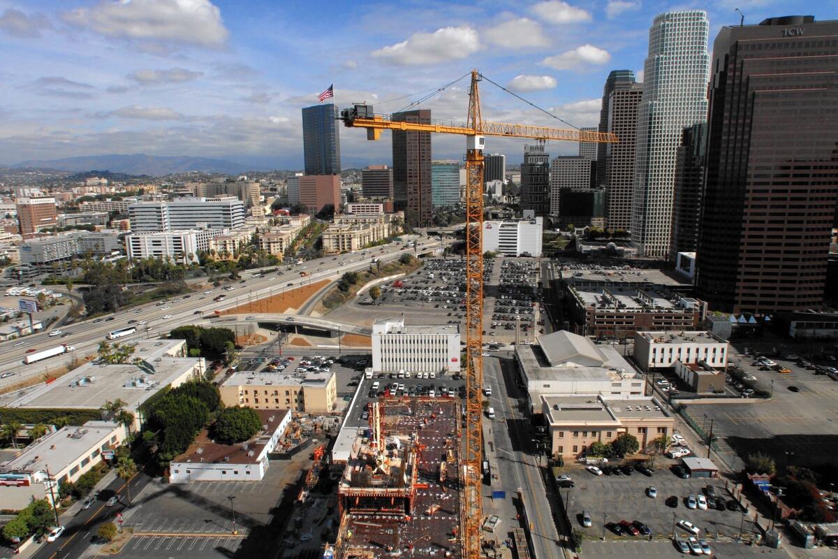 A total of 29 new hotels with 5,200 rooms are either under construction or on the drawing boards in Los Angeles County, including 1,825 rooms within walking distance of the convention center. Above, downtown-area hotels under development in 2013.