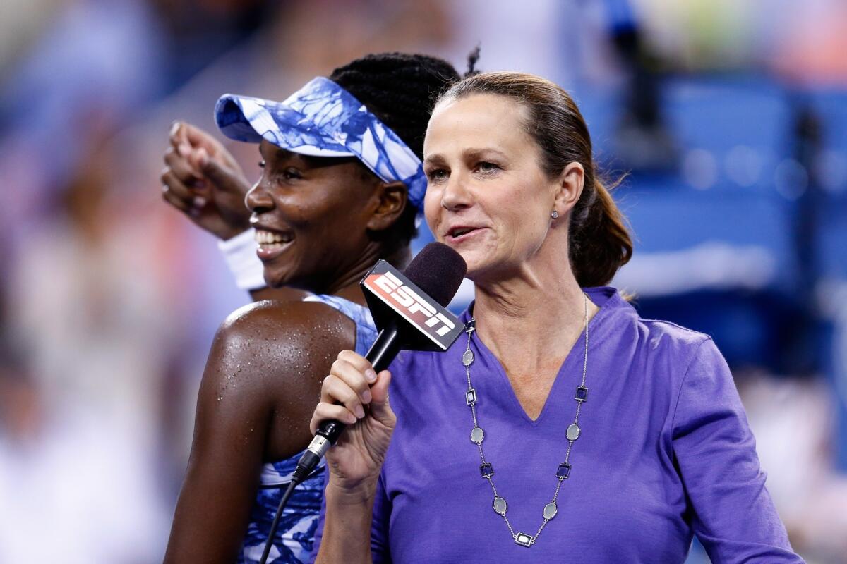 ESPN broadcaster Pam Shriver talks with Venus Williams after a victory over Timea Bacsinsky at the 2014 U.S. Open.