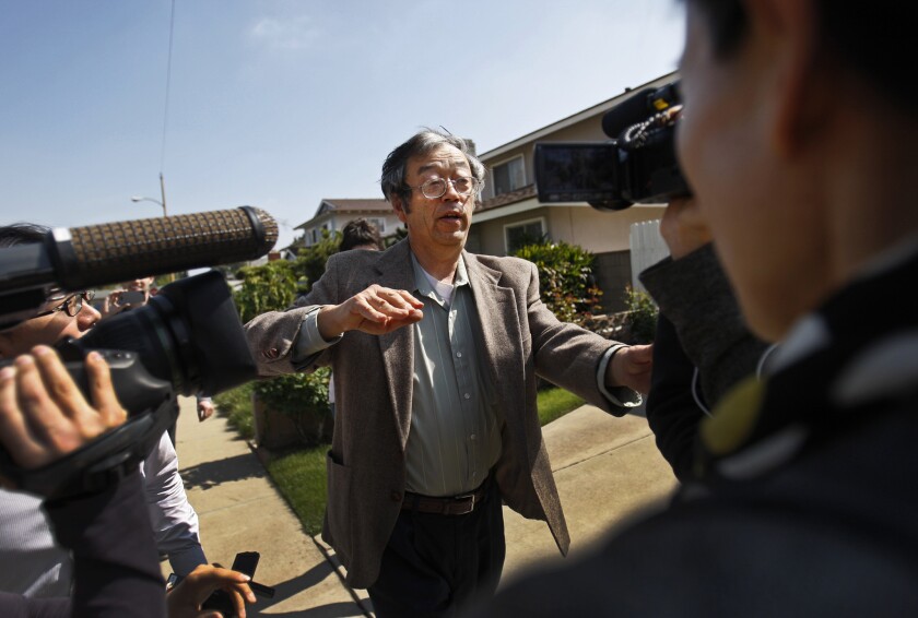 Is this bitcoin's creator? Journalists surround Satoshi Nakamoto as he walks from his home in Temple City.