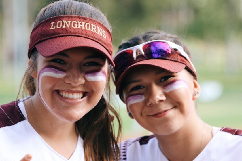 Danielle Ellis, left, and Sydney Prenatt, former softball players at Rancho Buena Vista High School in Vista, Calif., pose at Buena Vista Ballpark in Vista, Calif., May 10, 2018. As seniors, the friends and teammates were students in a government class taught by Timothy Leary, a beloved figure at the school for 26 years. In the first unit of Leary’s class, Ellis and Prenatt learned about the five concepts of democracy, including civil rights and Title IX’s guarantees of gender equality in sports. As they discussed the law and its purpose, a lightbulb went on about their softball field. (Parisa Ghopeh via AP)
