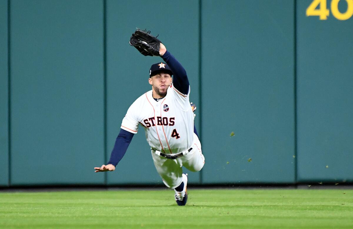 George Springer makes a diving catch.