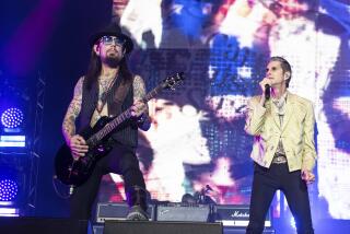 Dave Navarro, left, plays guitar and Perry Farrell of Jane's Addiction sings