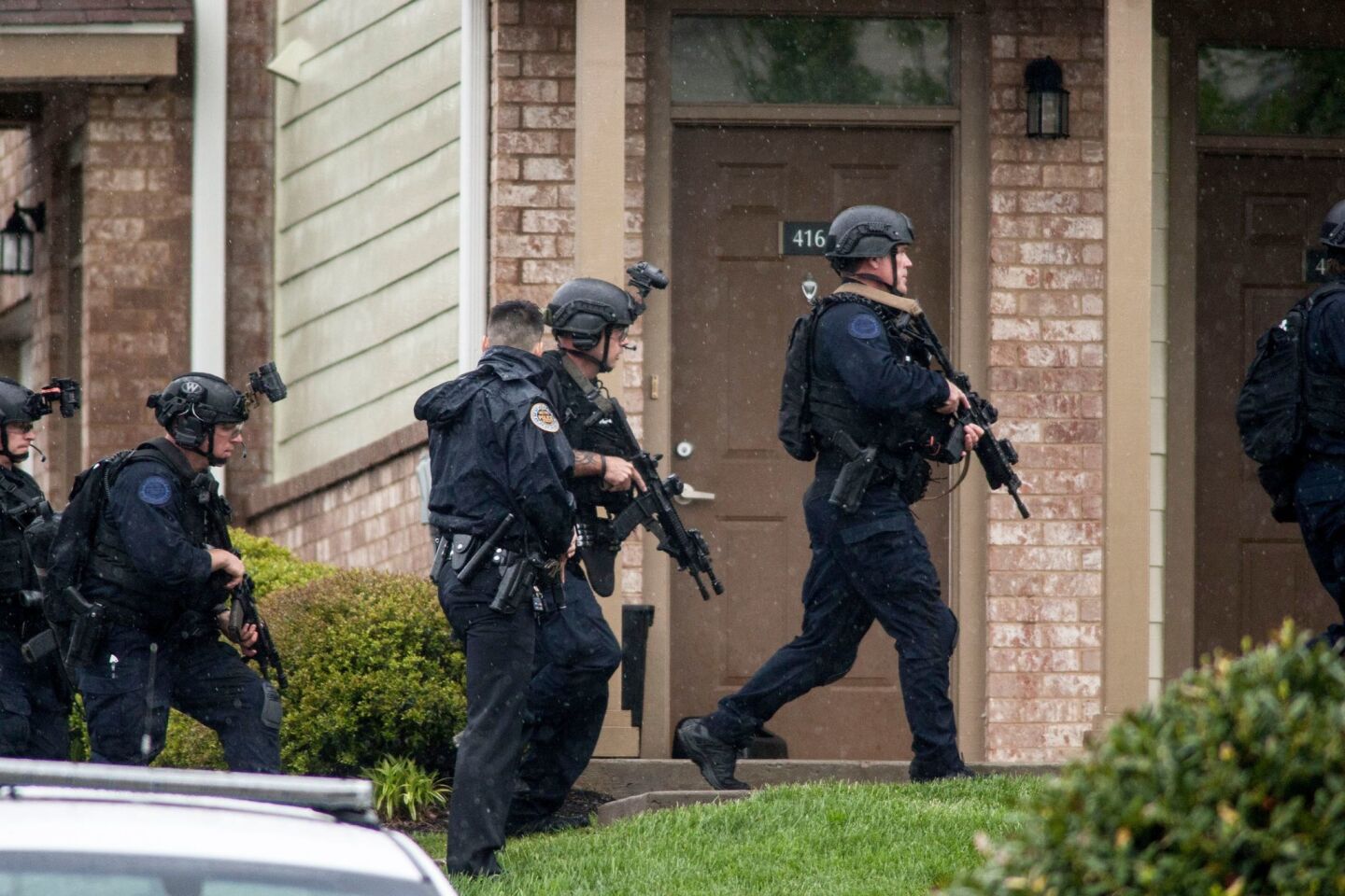 Metro Nashville Police use a SWAT team and bomb squad to serve a search warrant at the apartment of the suspected gunman who opened fire with an assault rifle at a Waffle House restaurant in Nashville.
