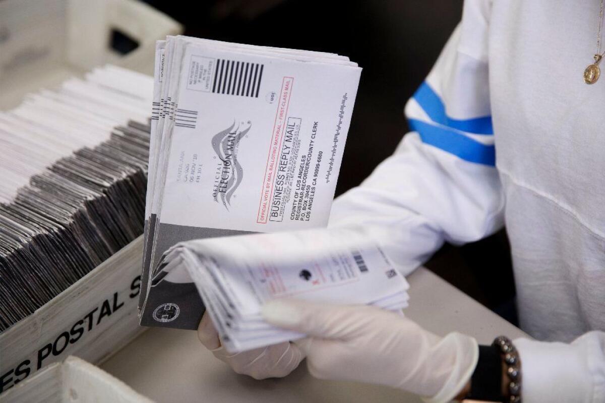 Mail-in ballots are sorted for counting at the L.A. County registrar-recorder's office on Nov. 7, 2018, in Norwalk, Calif. 