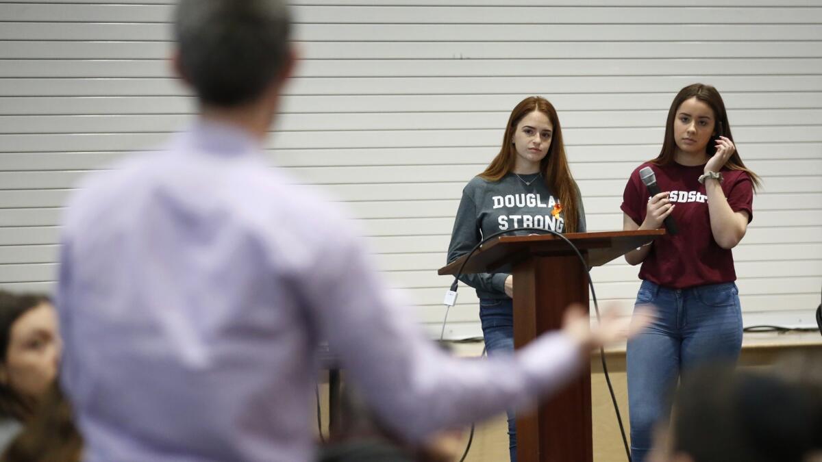 Marjory Stoneman Douglas High School students Hayley Licata, left, and Mia Freeman speak to students at Shalhevet High School in Los Angeles for a "Safe Schools" public discussion.