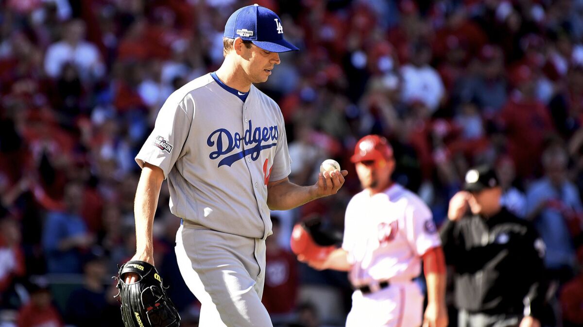Dodgers starting pitcher Rich Hill walks back to the mound in Game 2 of the NLDS against the Washington Nationals on Sunday.