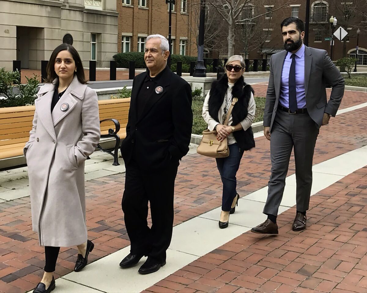 From left, Negeen Ghaisar, James Ghaisar, Kelly Ghaisar and Kouros Emami, family of Bijan Ghaisar walk outside federal court in Alexandria, Va., on Friday, March 6, 2020. A federal magistrate on Friday excoriated the government for refusing to turn over its investigative file in the death of Bijan Ghaisar shot by U.S. Park Police. The files are sought by the family of Bijan Ghaisar, who died in 2017 after he was shot by Park Police officers multiple times at the conclusion of a stop-and-go chase on the George Washington Parkway. (AP Photo/Matthew Barakat)